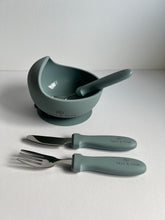 Load image into Gallery viewer, a baby blue suction bowl with a baby blue stainless steel spoon inside and fork and knife along side it
