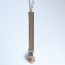Load image into Gallery viewer, cotton dummy clip in rust colour with a elephant logo on the wooden clip