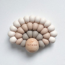 Load image into Gallery viewer, a silicone rainbow teether in dawn colour showing the wooden ball with Calf & Crew logo