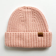 Load image into Gallery viewer, a chunky knit toddler beanie in blush colour with a leather calf & crew logo