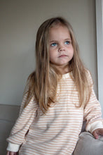 Load image into Gallery viewer, a child standing wear the tracksuit romper in peach striped
