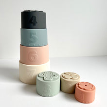 Load image into Gallery viewer, pastel silicone stacking cups, with some showing the top shape moulds and the others stacked, all showing their numbered sides