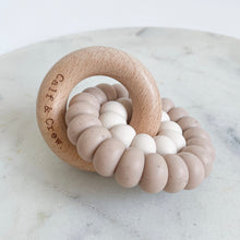 Load image into Gallery viewer, wooden ring with calf & crew logo around a double silicone ring in chai colour