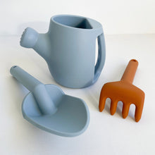 Load image into Gallery viewer, Hydrangea silicone garden set showing a blue spade and watering can next to a orange rake