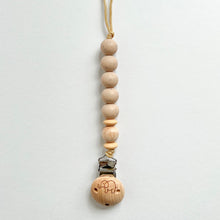 Load image into Gallery viewer, the silicone dummy clip in chai colour showing the elephant engraved wooden clip