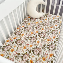 Load image into Gallery viewer, a white cot with a secret garden organic fitted cot sheet and a white moon pillow