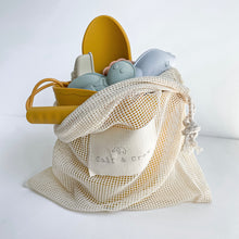 Load image into Gallery viewer, the silicone beach toy set in sunny side colour inside the cotton net bag