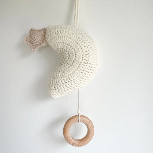 ivory crochet moon with a crochet star and a hanging wooden ring