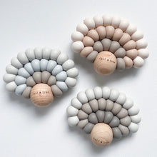 Load image into Gallery viewer, three silicone rainbow teethers in sky blue, dusk and dawn colour