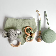 Load image into Gallery viewer, Sage coloured muslin bib with grey crochet elephant rattle, wooden silicone ring teether, silicone dummy clip in mint colour and soother case in sage colour