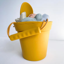 Load image into Gallery viewer, silicone beach toy set in sunny side showing the silicone moulds and spade inside the bucket
