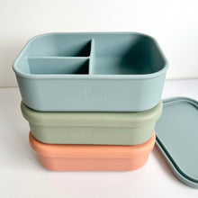 Load image into Gallery viewer, three silicone bento lunchboxes stacked in rose, sage and baby blue showing the embossed Calf & Crew logo and three part dividers