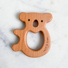 Load image into Gallery viewer, a wooden koala teether with the calf & crew logo engraved on the edge