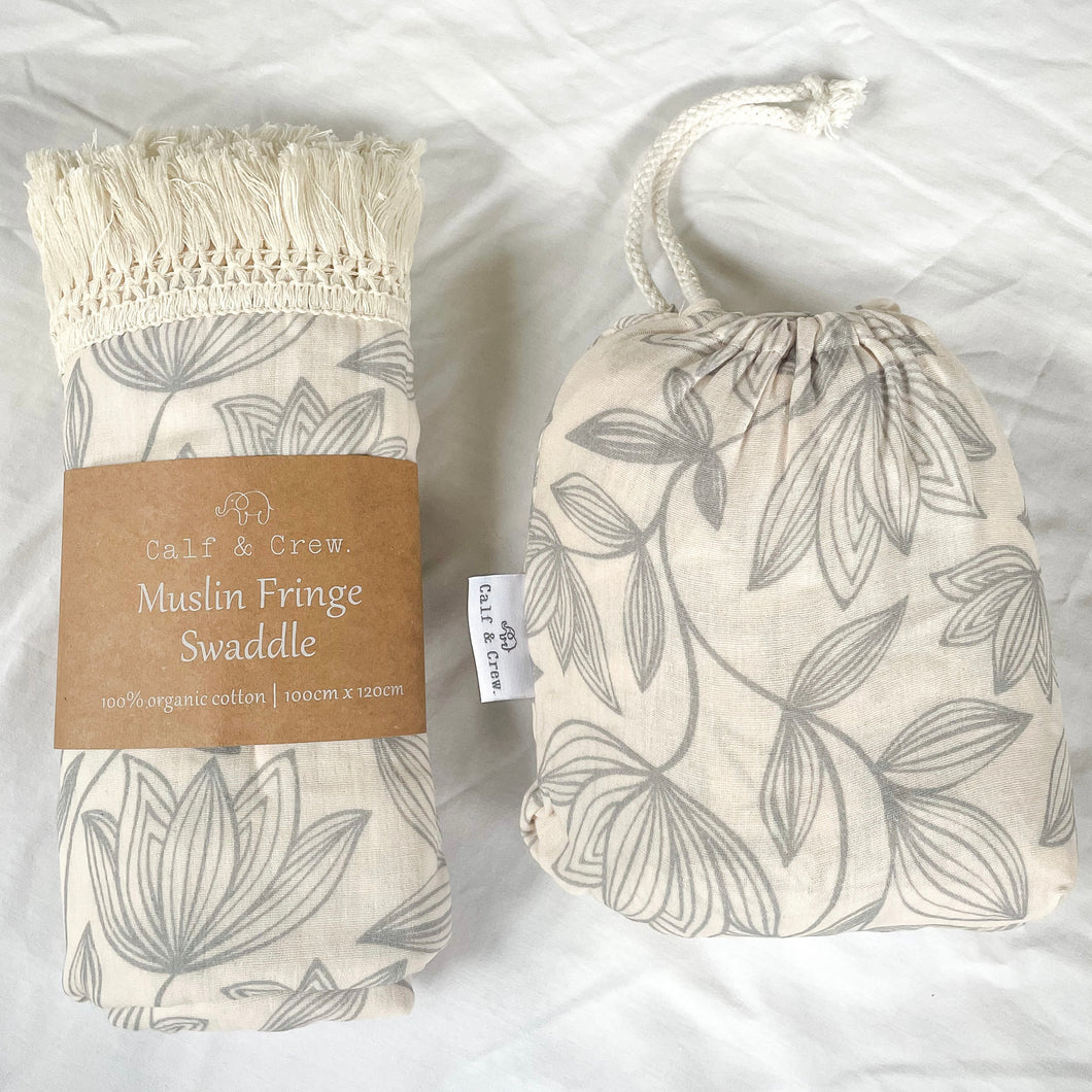 muslin fringe swaddle and organic cotton cot sheet in waterlily print