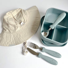 Load image into Gallery viewer, a folded everyday sunhat in sand with a open silicone bento lunchbox in baby blue and stainless steel spoon, fork, and knife in baby blue colour