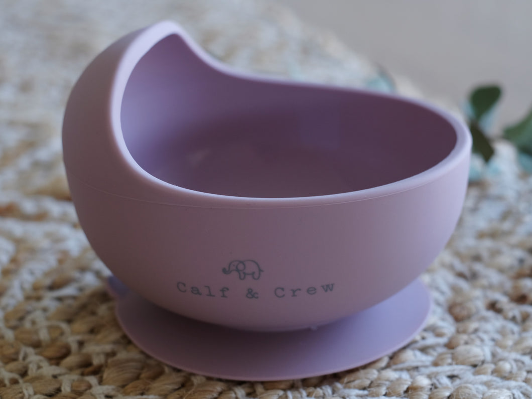 the silicone suction bowl in rose colour showing the calf & crew logo on the side