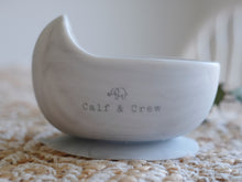 Load image into Gallery viewer, the silicone suction bowl in marble colour showing the calf &amp; crew logo on the side

