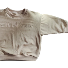 Load image into Gallery viewer, crew sweatshirt showing the sleeve and shape in eggnog colour with Calf &amp; Crew logo embroidered
