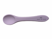 Load image into Gallery viewer, the silicone spoon in rose colour showing the Calf &amp; Crew logo on the handle

