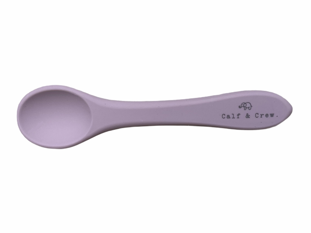 the silicone spoon in rose colour showing the Calf & Crew logo on the handle