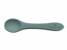 Load image into Gallery viewer, the silicone spoon in sage colour showing the Calf &amp; Crew logo on the handle
