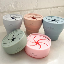 Load image into Gallery viewer, three expanded collapsible snack cups in grey, latte, and baby blue behind two collaped snack cups in sage and pink
