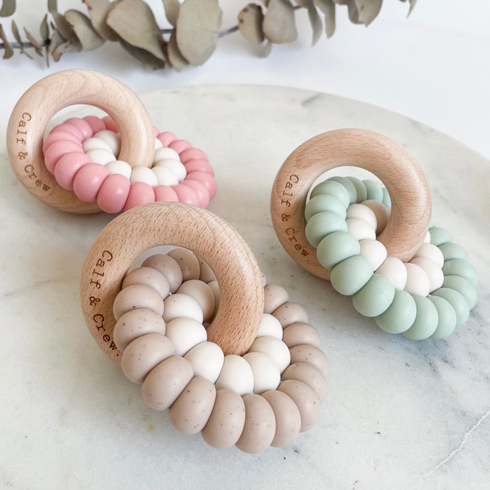 three double silicone ring teethers in blush, chai and mint