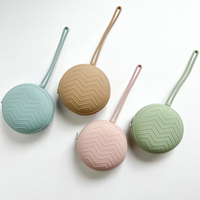 four soother cases in baby blue, latte, rose and sage colours