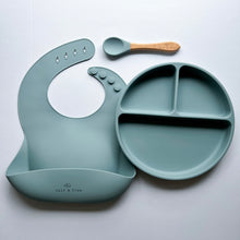 Load image into Gallery viewer, a silicone bib, suction divider plate and a beechwood spoon in baby blue colour
