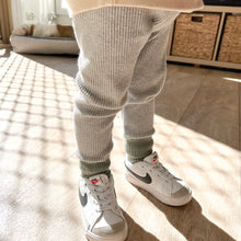 Load image into Gallery viewer, a child standing wearing the ribbed thick slim fit leggings in cloudy grey

