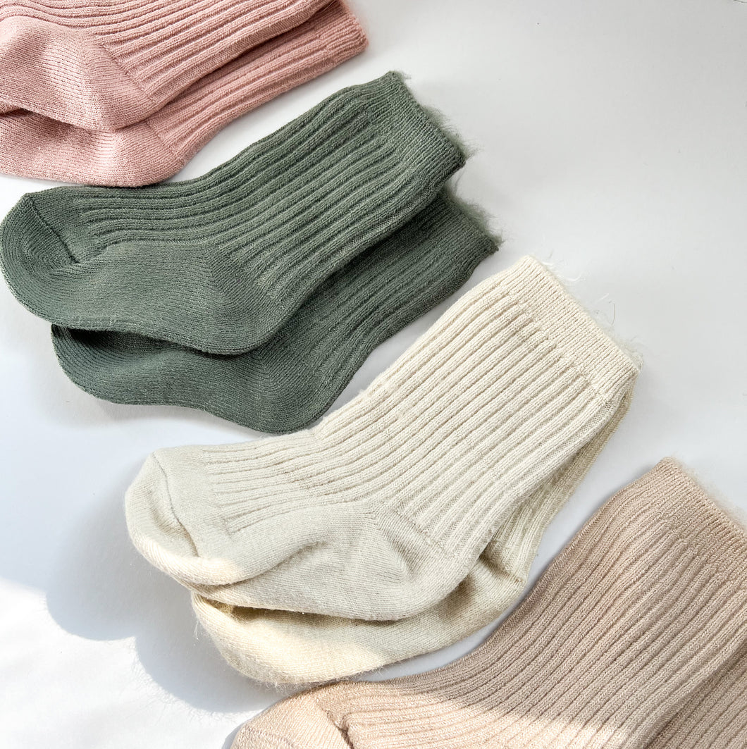 four pairs of crew cosy socks in blush, khaki, vanilla and latte