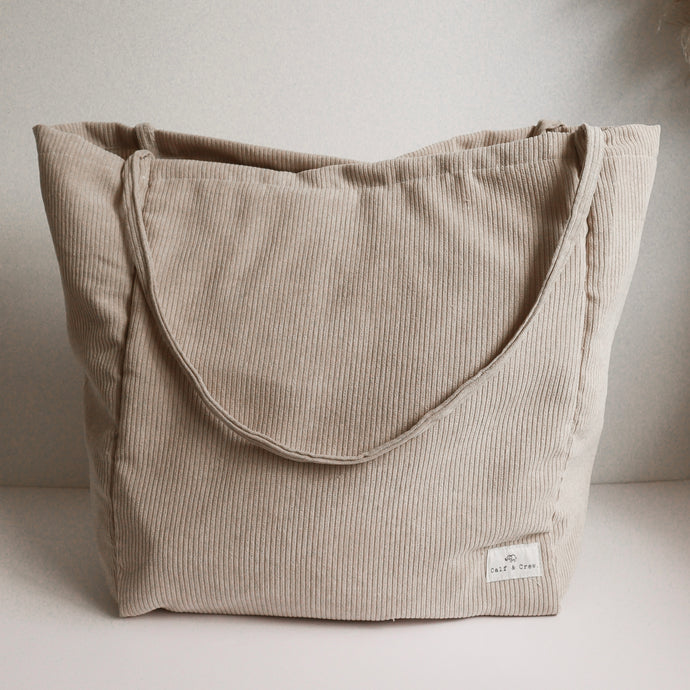 tan tote bag standing up