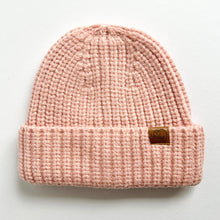 Load image into Gallery viewer, a chunky knit toddler beanie in blush colour with a leather calf &amp; crew logo
