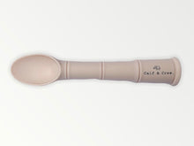 Load image into Gallery viewer, a my first baby spoon in sand silicone with the calf &amp; crew logo
