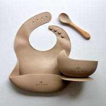Load image into Gallery viewer, Silicone bib, silicone suction bowl, and beechwood spoon in latte colour all with the Calf &amp; Crew logo

