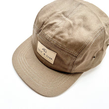 Load image into Gallery viewer, top view of the crew cap in camo showing the Calf &amp; Crew logo patch
