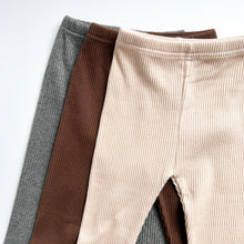 Load image into Gallery viewer, the ribbed straight fit leggins laying flat in charcoal, chocolate and beige
