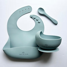 Load image into Gallery viewer, Silicone bib, silicone suction bowl, and silicone spoon in baby blue colour all with the Calf &amp; Crew logo
