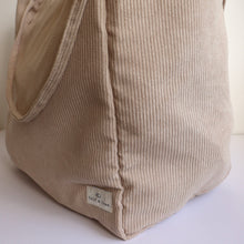 Load image into Gallery viewer, close up of tan corduroy bag showing Calf &amp; Crew logo 
