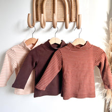 Load image into Gallery viewer, three thick long sleeve skivvy tops hanging on wood hangers in peach stripped, chocolate and maroon stripped
