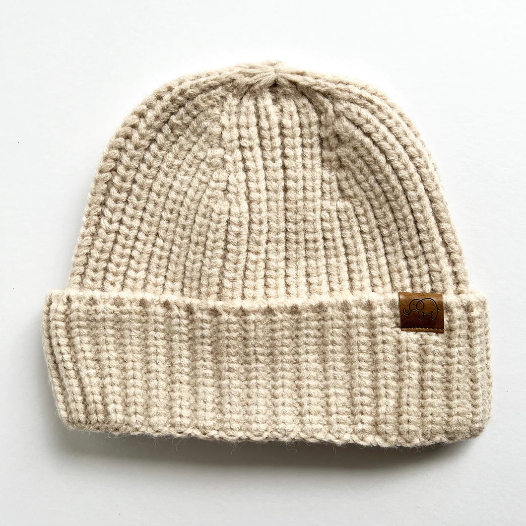 chunky knitted beanie in oatmeal with a small elephant logo
