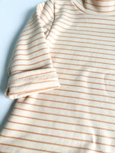 Load image into Gallery viewer, a close up of the sleeve of the peach stripped thick long sleeve top 

