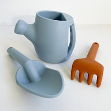 Load image into Gallery viewer, Hydrangea silicone garden set showing a blue spade and watering can next to a orange rake
