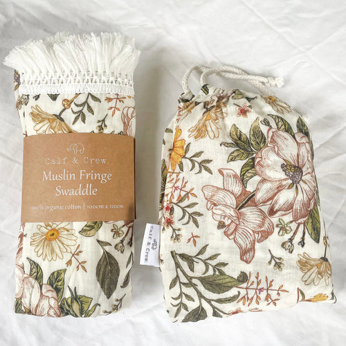muslin fringe swaddle and organic cotton cot sheet in secret garden print