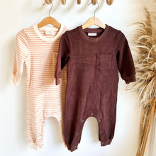 Load image into Gallery viewer, two kids tracksuit rompers in peach striped and coffee colour hanging on wooden hangers
