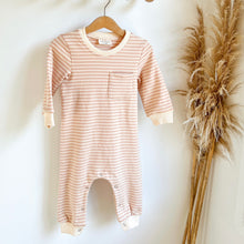 Load image into Gallery viewer, the kids tracksuit romper in peach striped hanging on a wood hanger
