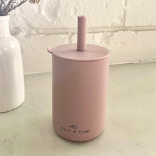 Load image into Gallery viewer, the silicone sippy cup in rose colour showing the calf &amp; crew logo on the bottom of the cup
