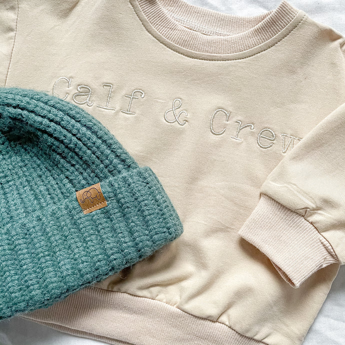 the crew sweatshirt in eggnog colour under the toddler beanie in forest