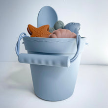 Load image into Gallery viewer, blue silicone bucket with the silicone shape moulds and spade inside
