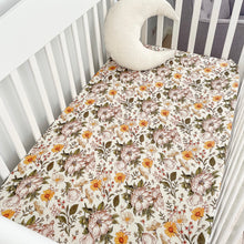 Load image into Gallery viewer, a white cot with a secret garden organic fitted cot sheet and a white moon pillow
